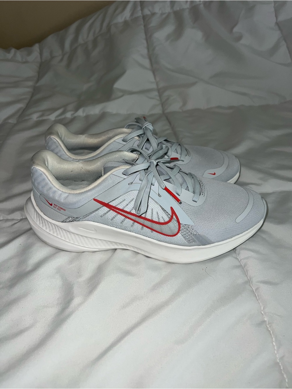 Nike Light Blue Running Sneakers with Red Swoosh